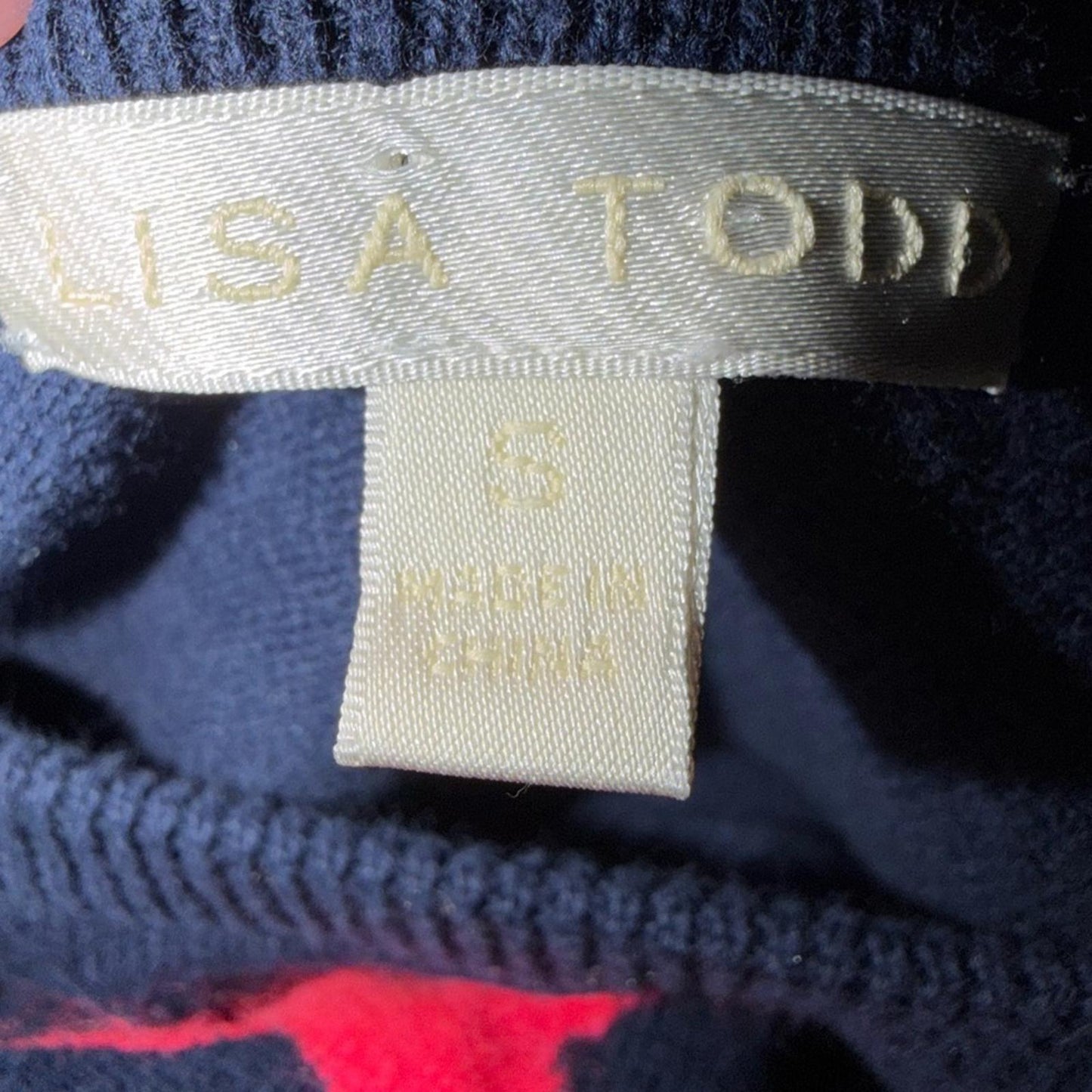 Lisa Todd Navy Sweater with Vibrant Stars